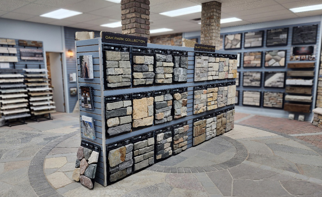 The Concrete Service Showroom - Natural Stone Veneer Displays Interior view of The Concrete Service showroom featuring various natural stone veneer displays and flooring samples.